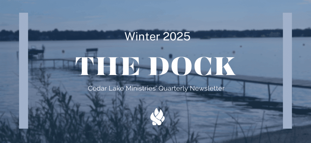 A lake with a wooden dock and benches, blurred in the background, with the text "Winter 2025, The Dock, Cedar Lake Ministries’ Quarterly Newsletter" overlaid.